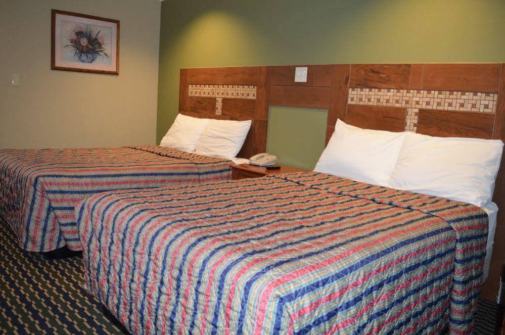 رالي Budgetel Inn And Suites المظهر الخارجي الصورة